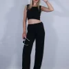 Σετ ριπ ελαστικό μαύρο παντελόνι και crop top