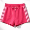 Σορτσάκι αθλητικό φούξια με ρίγες στα πλαινά